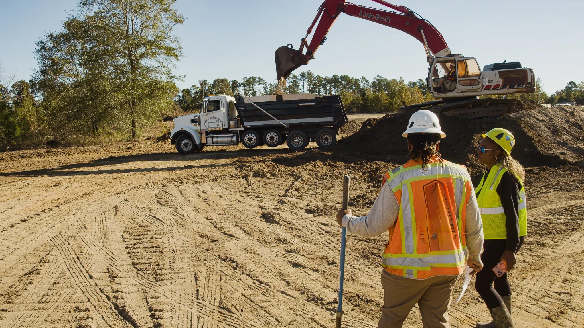 Gulley's Backhoe Service crew on a fill dirt job site in Garner, NC